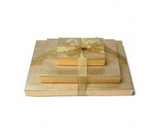 Three boxes wrapped in gold paper tied with a ribbon.