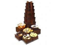 A tower of chocolate covered donuts is shown.