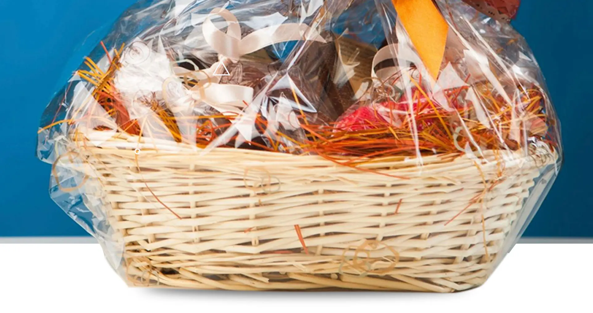 A basket of feathers and other items in it.